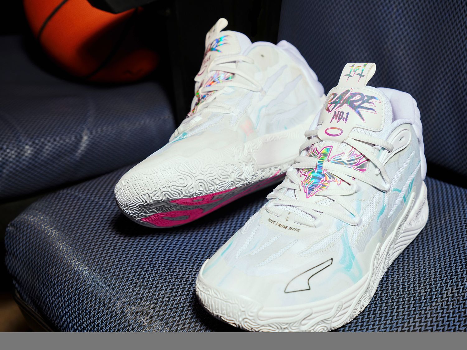 LaMelo Ball's white and blue PUMA sneakers.